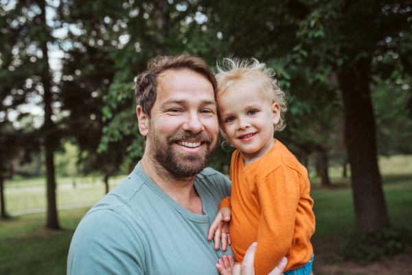 Portrait of dad and child enjoying time together. Fathers day concept.