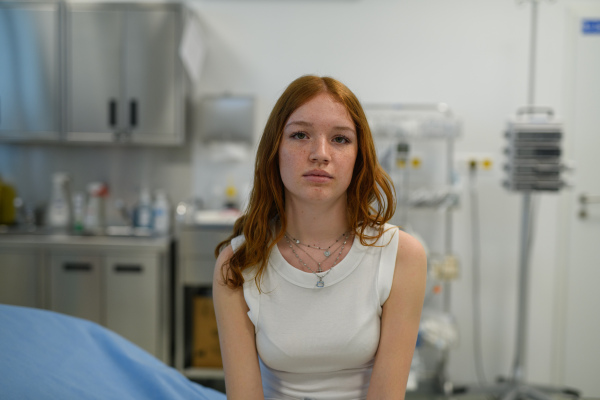 Teenage girl waiting for medical examination in hospital. Portrait.