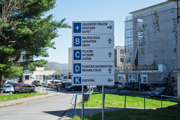 Navigational signage in front of public hospital buildings