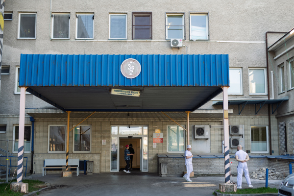 Main hospital entrance with worn facade.