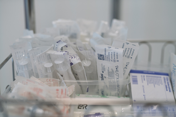Sterile syringes and medical supplies in hospital storage tray