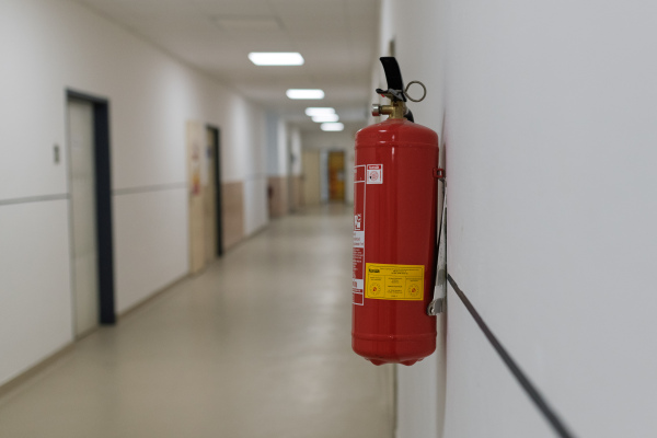 Emergency fire extinguisher in medical corridor