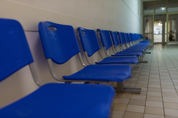Waiting area in old municipal hospital, in front of doctor's offce.