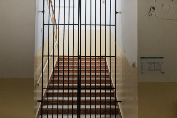Empty old staircase with bars in municipal hospital.