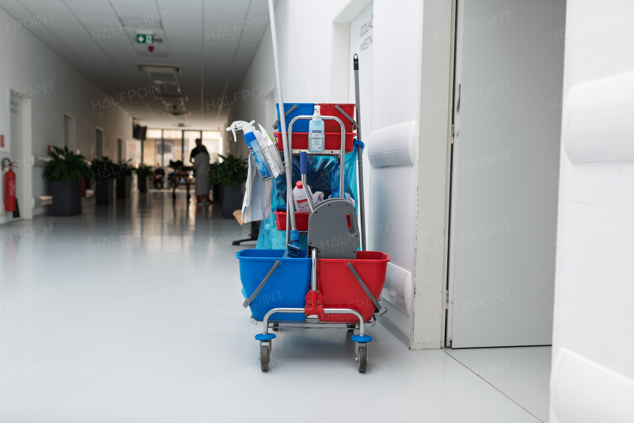 Hospital cleaning cart with supplies in corridor
