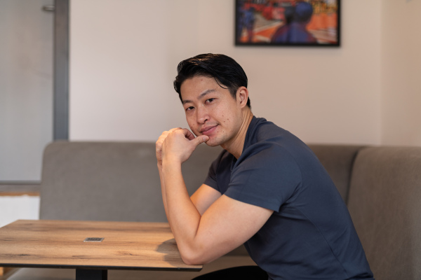 Casual moment of man waiting for food in cafe or restaurant.