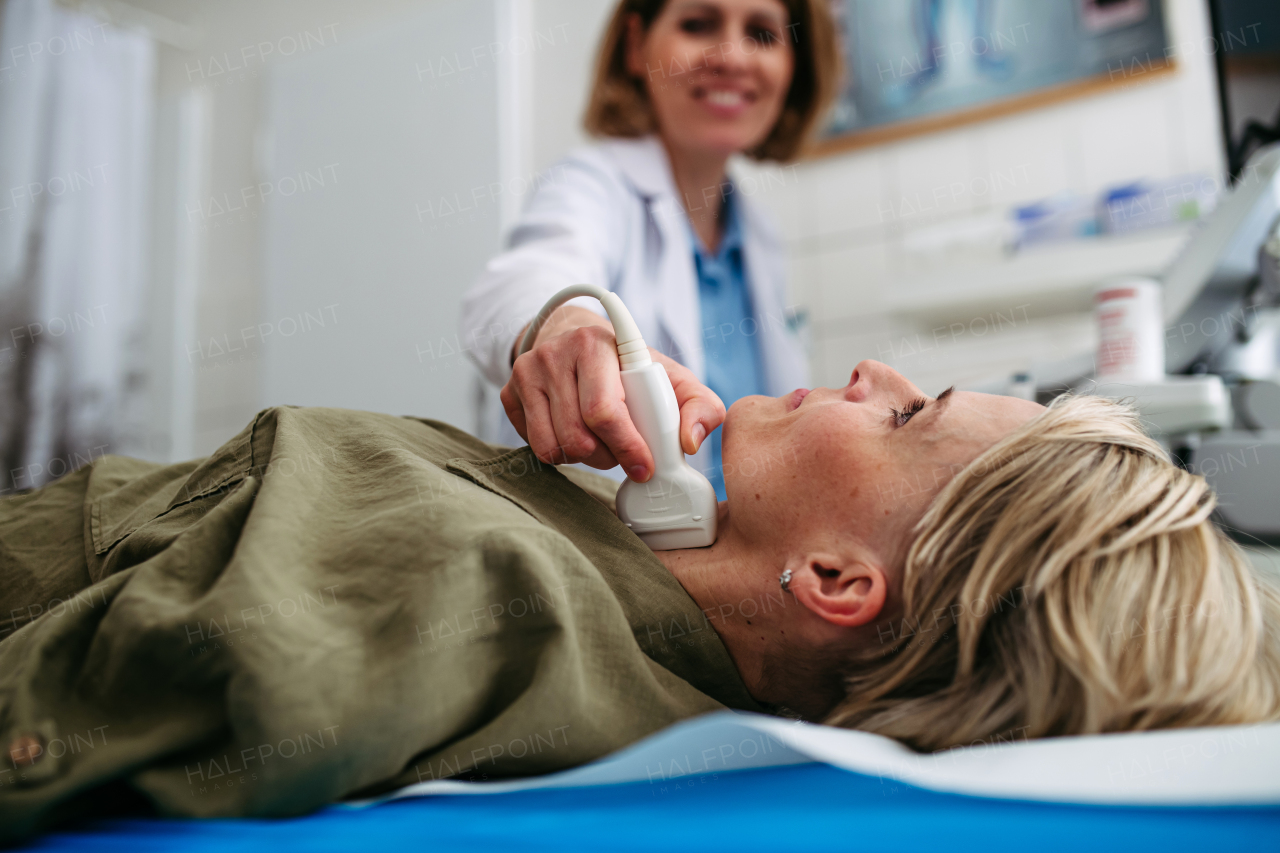Female patient undergoing thyroid ultrasound examination. Lymp node sonography.