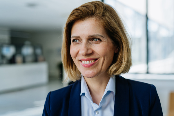 Portrait of female medical sales representative, medical clinic setting.