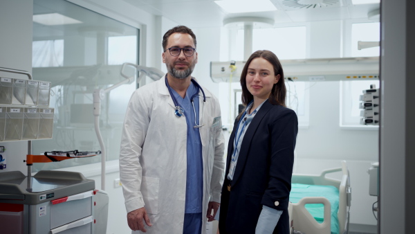 A pharmaceutical sales respresentatives with doctor in hospital.