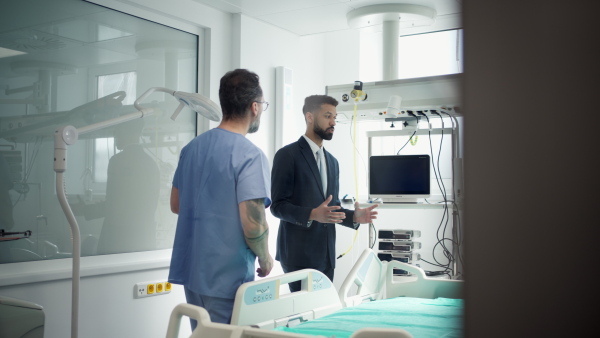 A clinic director showing new doctor around the hospital workplace.