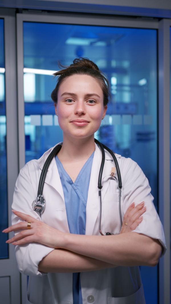A smiling young female doctor in hospital.