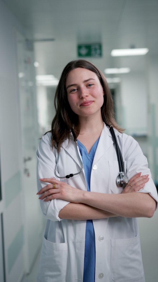 A smiling young female doctor in hospital.