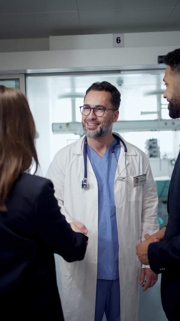 New managers introduces themselves to the medical staff. Modern clinic, hospital setting.
