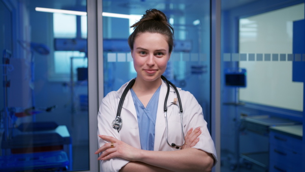 A smiling young female doctor in hospital.