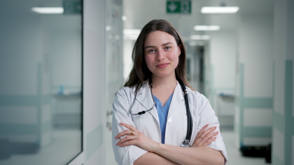 A smiling young female doctor in hospital.