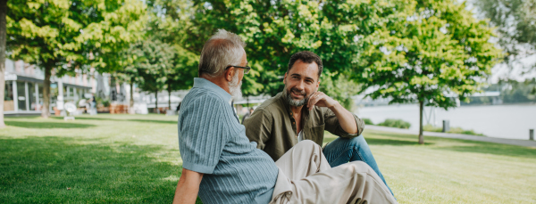 Handsome mature man talking with his older father.Fathers day concept.