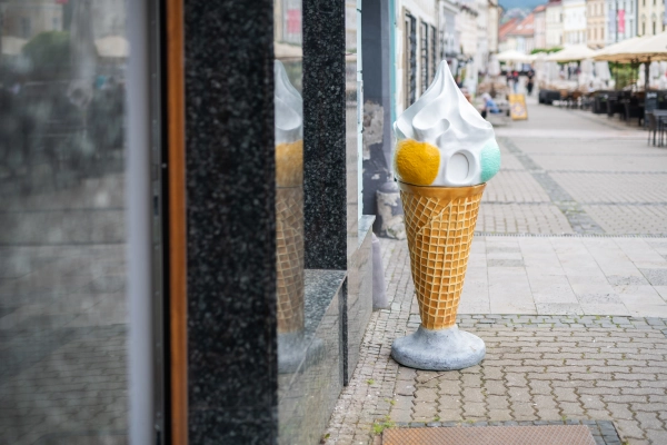 City square with ice cream parlor on a summer day
