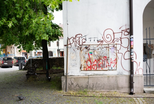 Graffiti and urban decay on historic building wall in city center