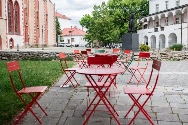Colorful cafe seating in front of the Old Market Hall in Banska Bystrica, Stara trznica.