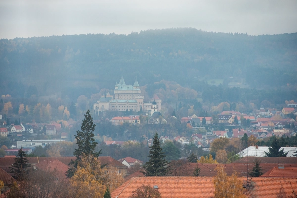 Bojnice Castle in fog during sunrise.