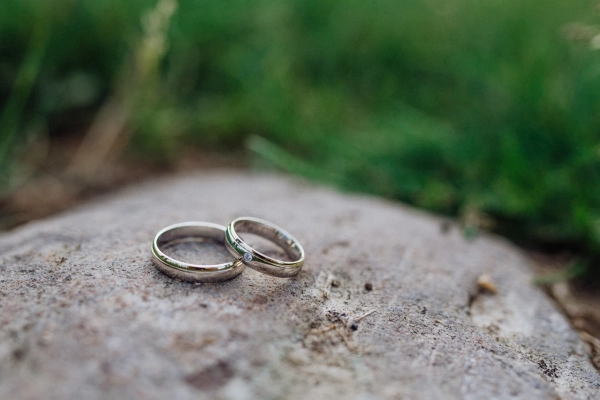 Close-up of wedding rings with a diamond.