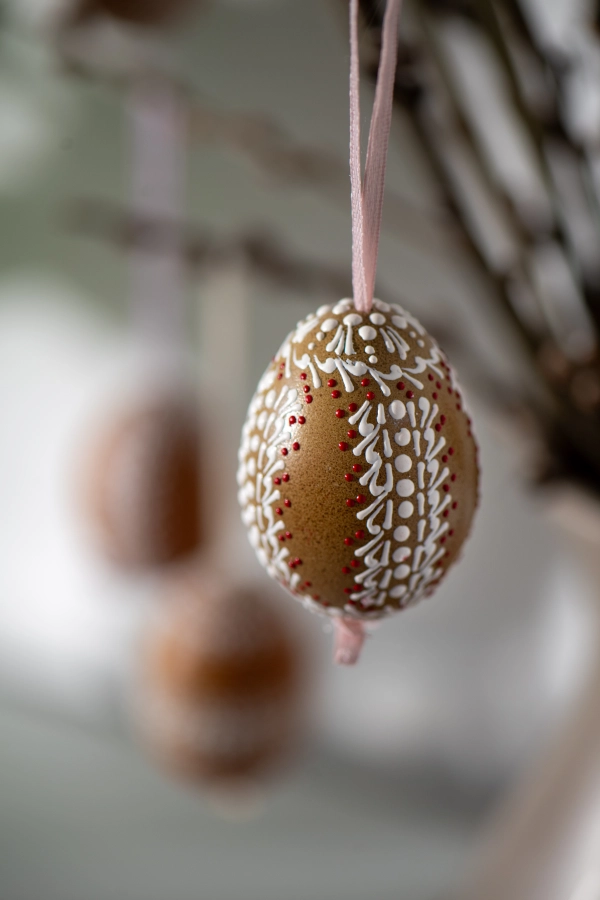 Easter decoration, painted easter eggs on pussy willow branches.